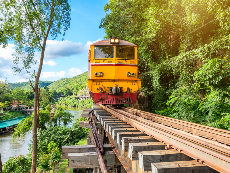 Ancient train running on wooden railway in Tham Krasae